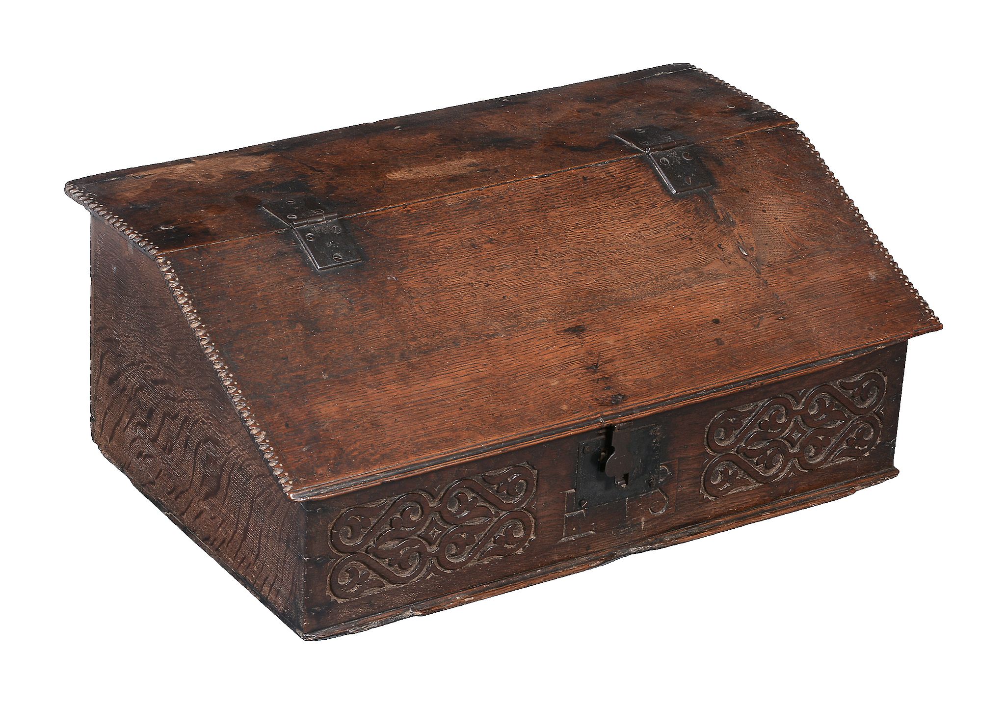 A William and Mary carved oak bible-box, circa 1690, the lift top opening to two drawers and