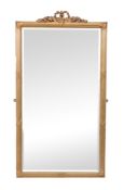 A Continental giltwood wall mirror , 20th century, the bevel plate within a reeded frame, 138cm