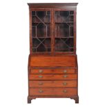 A mahogany bureau bookcase, incorporating associated George III and later elements, the astragal