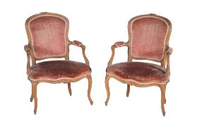 A pair of Louis XV carved walnut fauteuil, circa 1760, each cartouche shaped moulded back