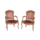 A pair of Louis XV carved walnut fauteuil, circa 1760, each cartouche shaped moulded back