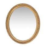 A giltwood oval wall mirror , in Regency style, late 19th century, with rope-twist frame, 92cm