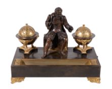 A Continental gilt and patinated bronze encrier, mid 19th century, surmounted by a seated figure