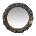 A Continental painted terracotta wall mirror, second half 19th century, the circular plate within