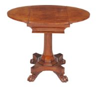 A George IV kingwood games table , circa 1825, the oval top with sliding section revealing a tooled