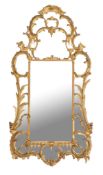 A carved giltwood and composition wall mirror in George III style , late 19th century, the