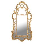 A carved giltwood and composition wall mirror in George III style , late 19th century, the