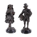 A pair of Continental patinated bronze models of itinerant musicians, late 19th century, a young