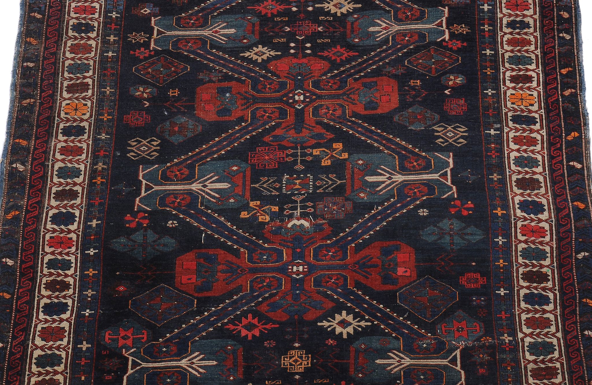 A Caucasian rug , the navy field decorated with polychrome geometric foliate motifs, approximately - Image 2 of 2