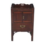 A George III mahogany commode , circa 1780, the tray top with pierced handles, 76cm high, 48cm