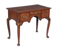 A George III oak side table , mid 18th century, on faceted cabriole legs, 70cm high, 87cm wide,