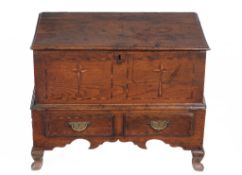 A George III oak and parquetry inlaid coffer bach, circa 1780, the hinged lid above the star motif