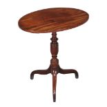 A George III mahogany oval tripod table , circa 1790, 73cm high, the oval strung top above a turned