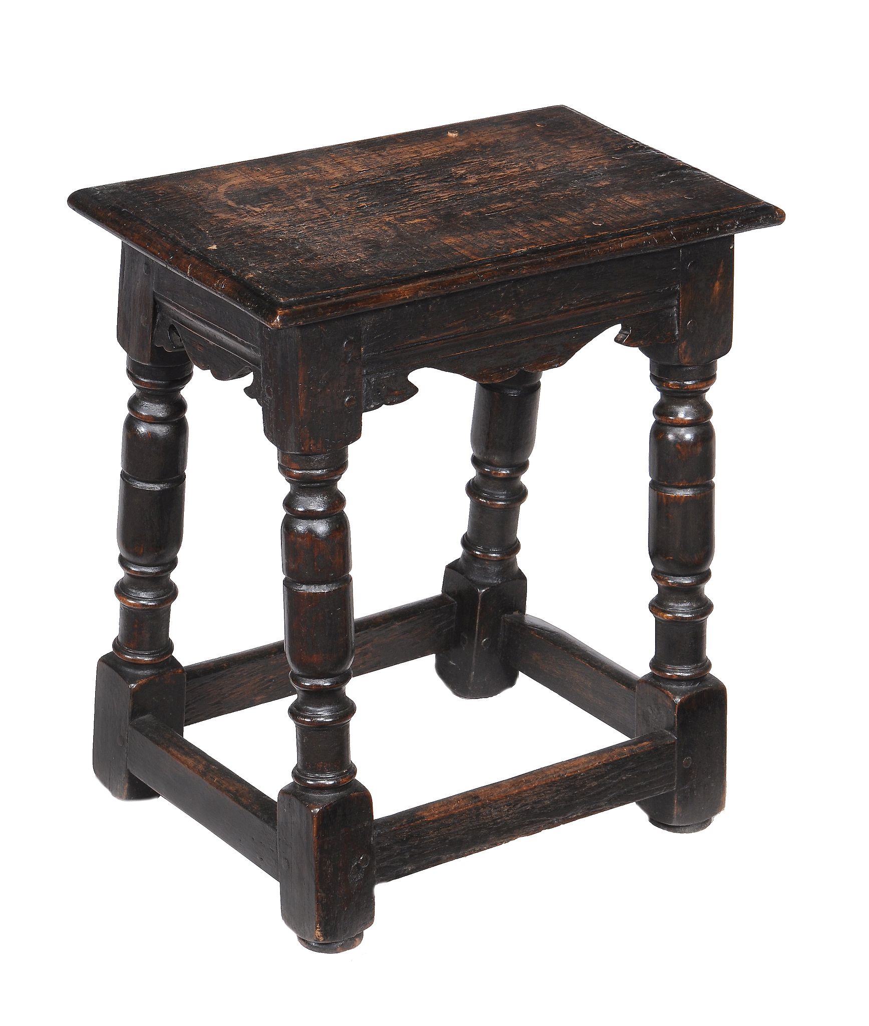 An oak joint stool in Charles I style , the solid seat above turned legs and peripheral stretchers
