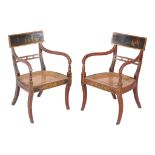 A pair of Regency japanned, red lacquered and gilt decorated armchairs , circa 1815, the bar backs