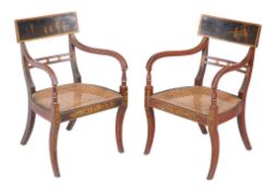 A pair of Regency japanned, red lacquered and gilt decorated armchairs , circa 1815, the bar backs