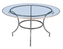 An iron and glass mounted circular dining table , of recent manufacture, 71cm high, 132cm diameter,