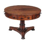 A George IV goncalo alves drum table , circa 1825, the frieze with four drawers interspersed with