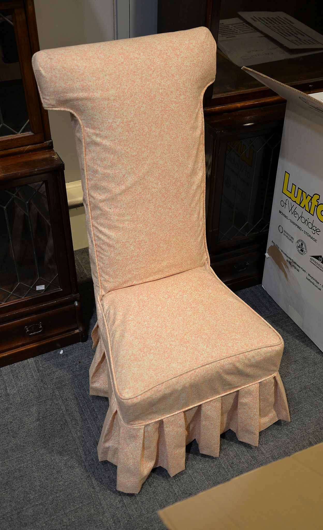 A Victorian ebonised prie-dieu, with mottled pink loose covers, 102cm high