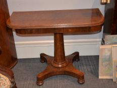 Ω A rosewood and mahogany tea table, the plum pudding mahogany top with partridgewood banding above