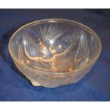 A Jobling Opalique glass bowl, circa 1935, moulded in relief with three exotic birds, 19cm diameter