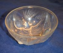 A Jobling Opalique glass bowl, circa 1935, moulded in relief with three exotic birds, 19cm diameter