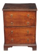 An oak box commode, late 18th/ early 19th century, the hinged action fronted by false drawers,