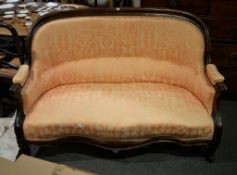 A mid-Victorian walnut show frame two seat sofa, 150cm wide