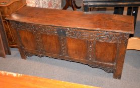 An oak four panelled coffer, 17th century and later, 69cm high, 153cm wide, 44cm deep