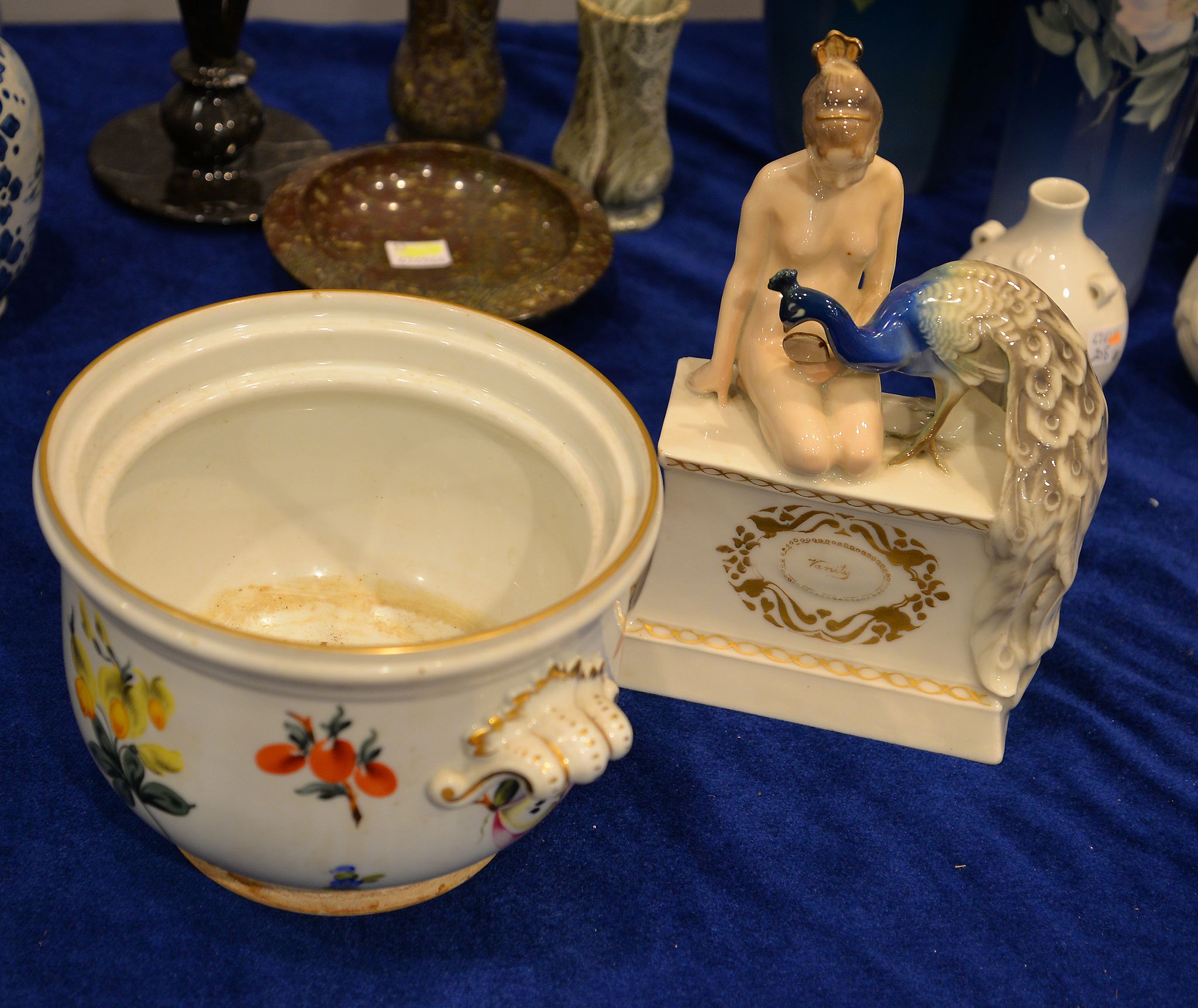 A Rorstrand porcelain group of a maiden and her peacock, entitled Vanity, 23cm high, together with a