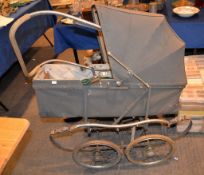 A pram, a doll's pram and a doll's pushchair, and other items