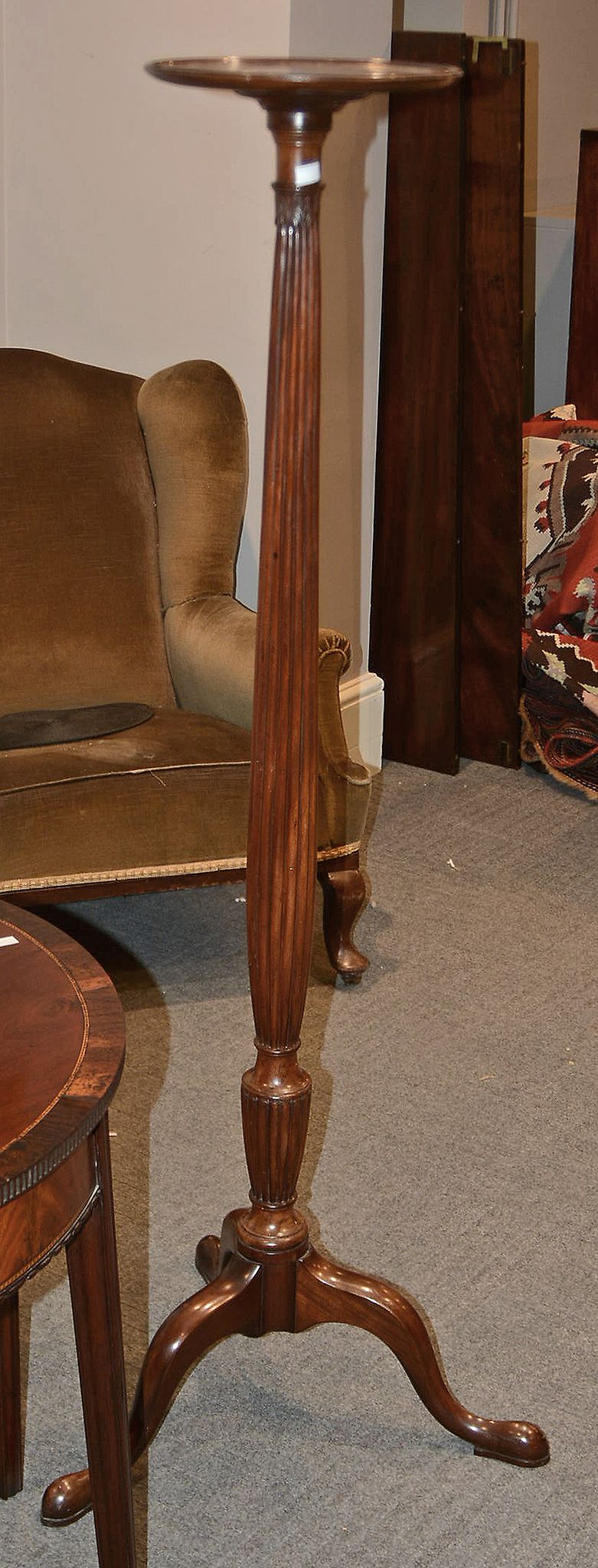 A mahogany torchère in George III style, 152cm high, together with another smaller, 89cm high