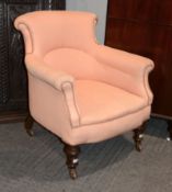 A Victorian tub armchair in the manner of Howard & Sons, the castors stamped Druce & Co, and with