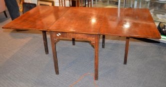 A mahogany drop-leaf table, the centre of a larger dining table, 70cm high,183cm long, 99cm wide