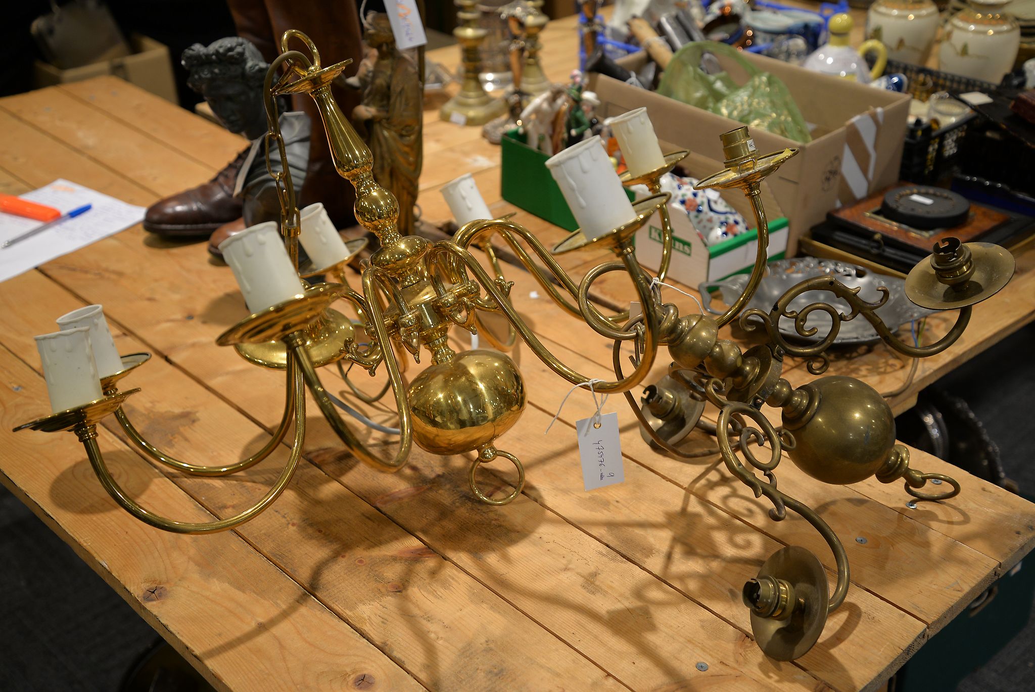 A glazed hall lantern and two Dutch type brass chandeliers