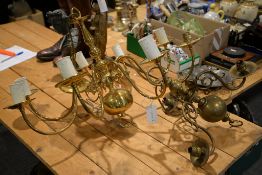 A glazed hall lantern and two Dutch type brass chandeliers