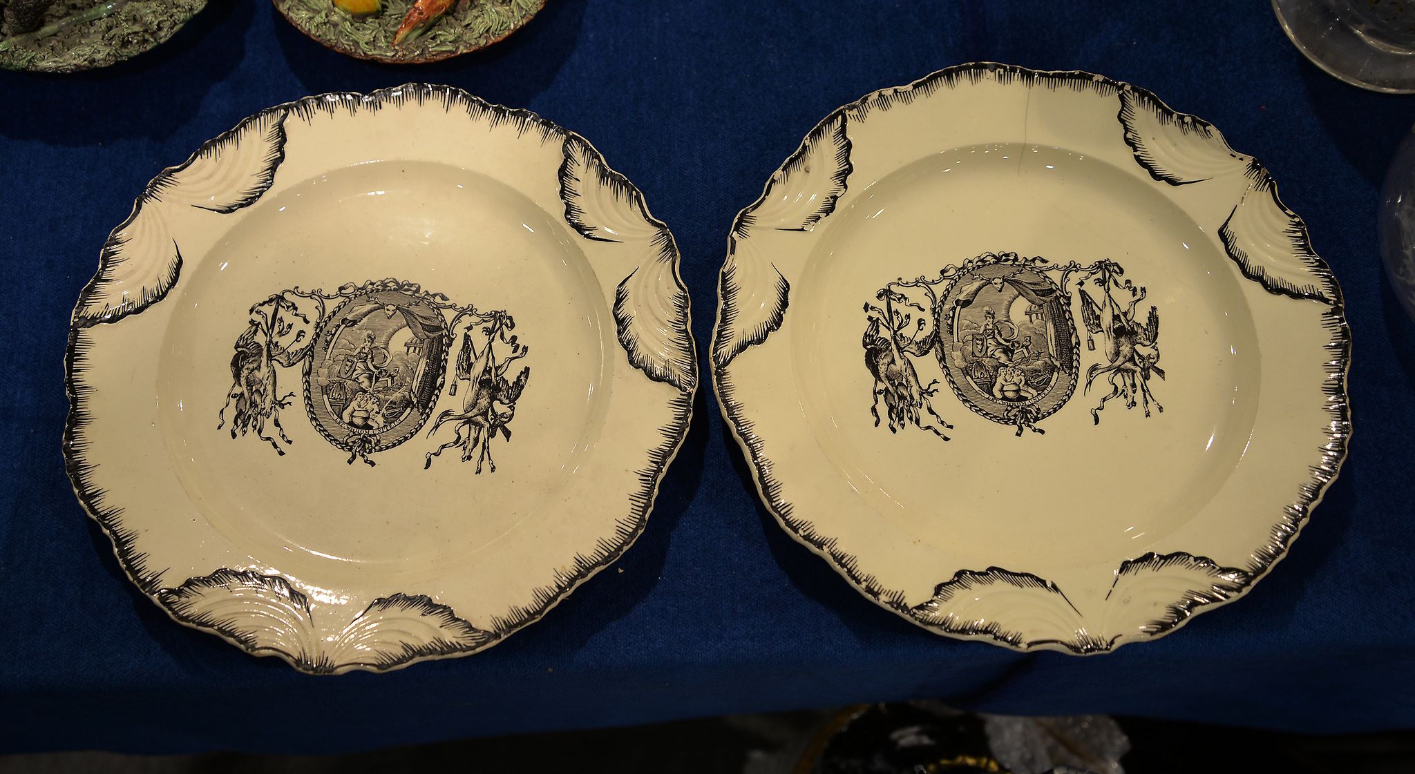 A pair of late 18th century creamware plates, printed in black with Britannia, and inscribed 'Let