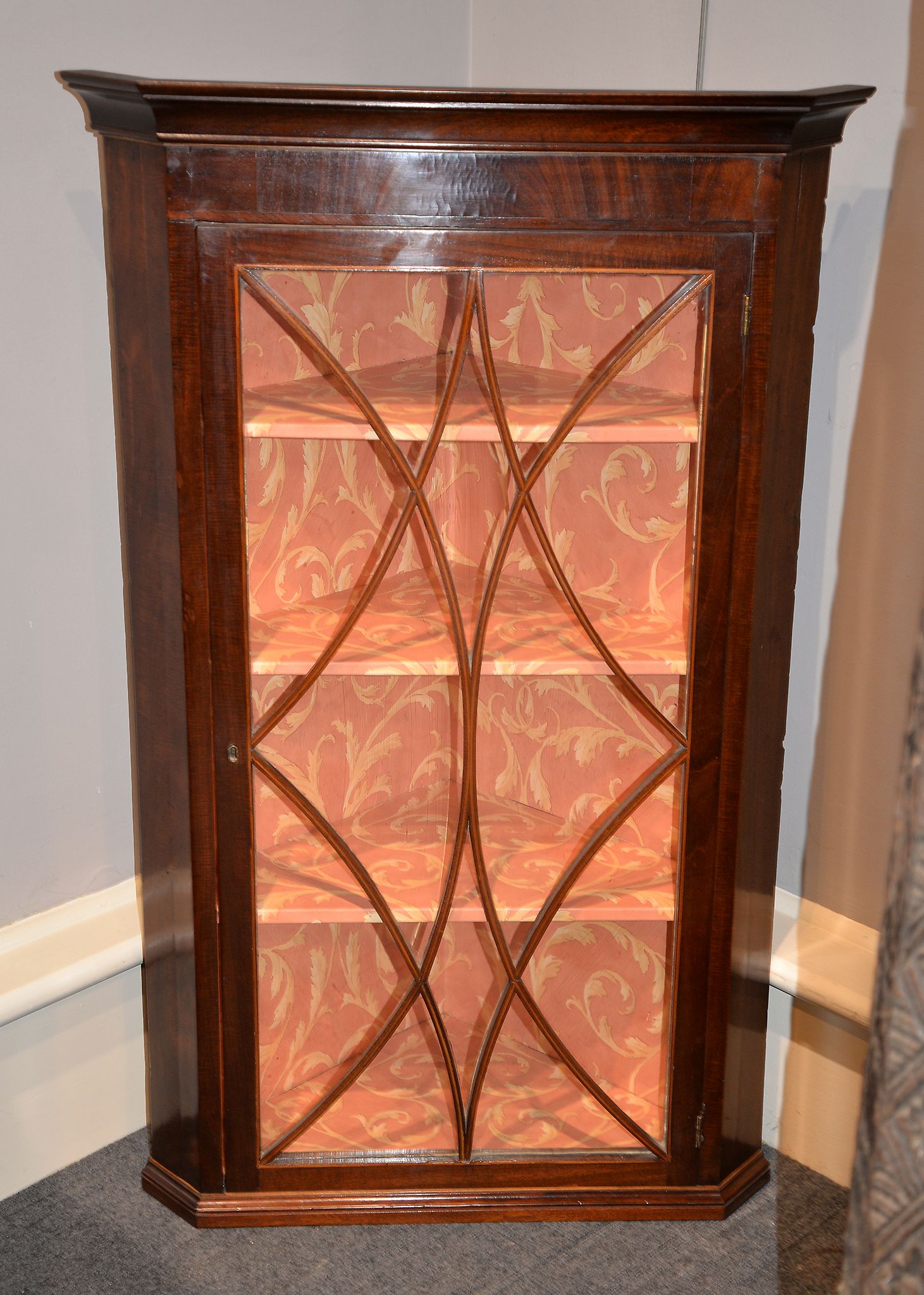 A mahogany corner wall cupboard, with glazed door, 103cm high