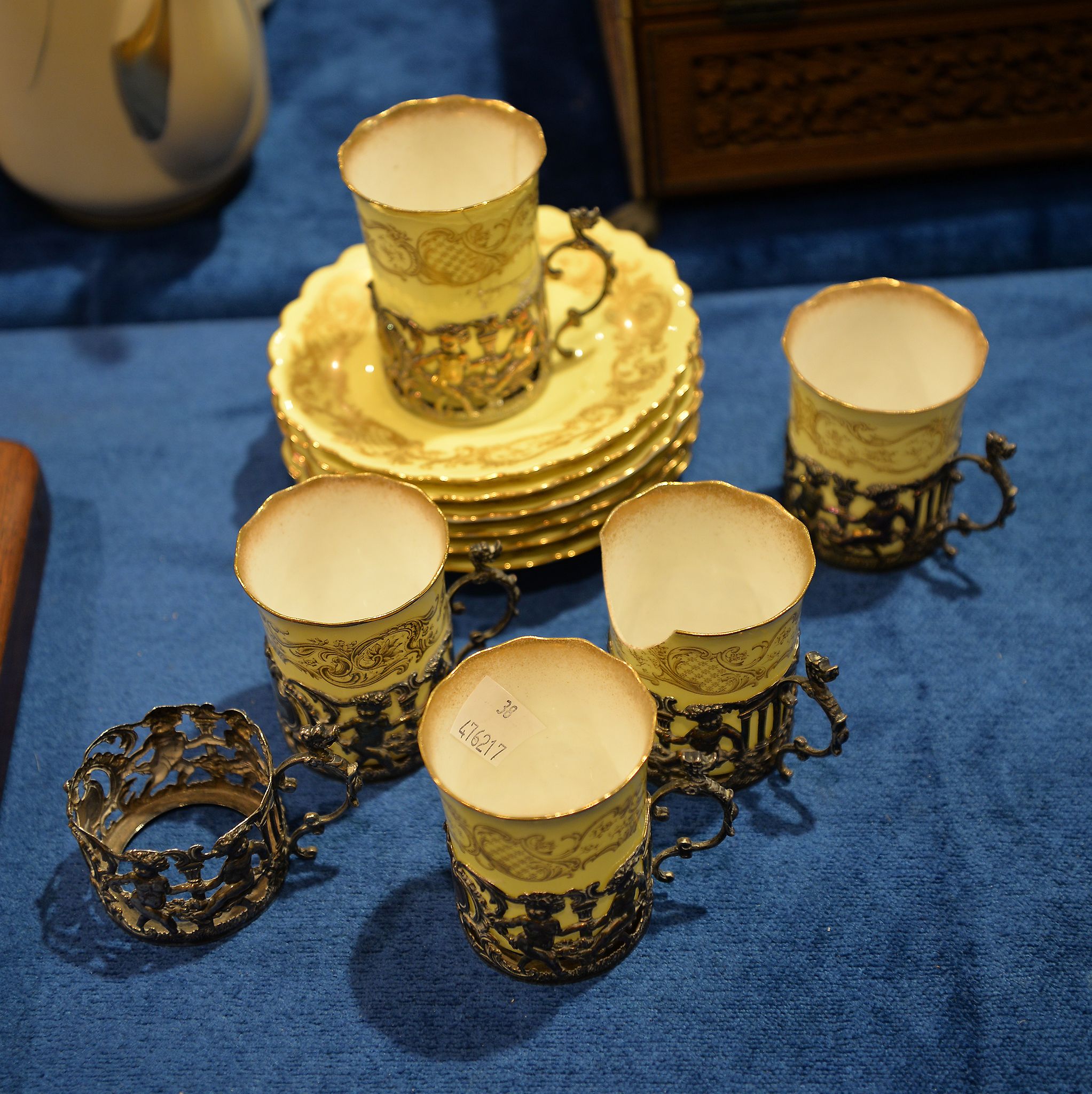 Six silver cup holders, with five Royal Worcester liners and six saucers