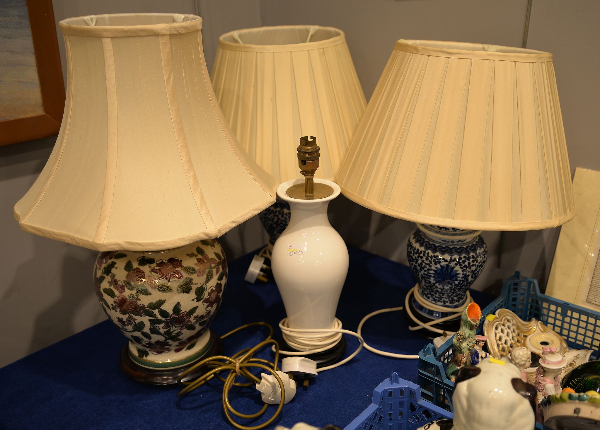 A pair of Chinese blue and white porcelain baluster table lamps and shades, 48cm high overall, and