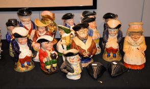 An assortment of Toby and character jugs , various dates, (15), together with two hat pattern lids