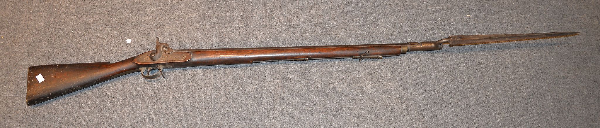 A Gilks Wilson Co. military percussion musket and socket bayonet, the lock plate stamped TOWER and
