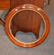 A vacant round mahogany mirror frame, 62cm diameter