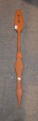 A West African carved paddle, 104cm long