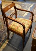 A Regency mahogany elbow chair with bar back and reeded arms, 85cm high