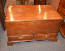 An oak mule chest in George III style, including some period timbers, the hinged lid enclosing