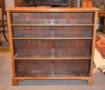 A walnut bookcase, with adjustable shelves
