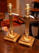 A pair of brass columnar table lamps, from Mappin & Webb, each 42cm high