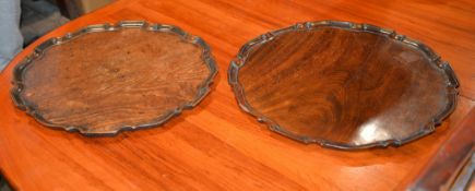 A George III mahogany pie crust bordered tray, 45.5cm diameter and another larger