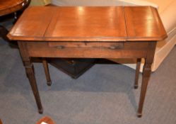 An oak writing table, with lift top enclosing a later fitted interior, on square tapering legs, 76cm